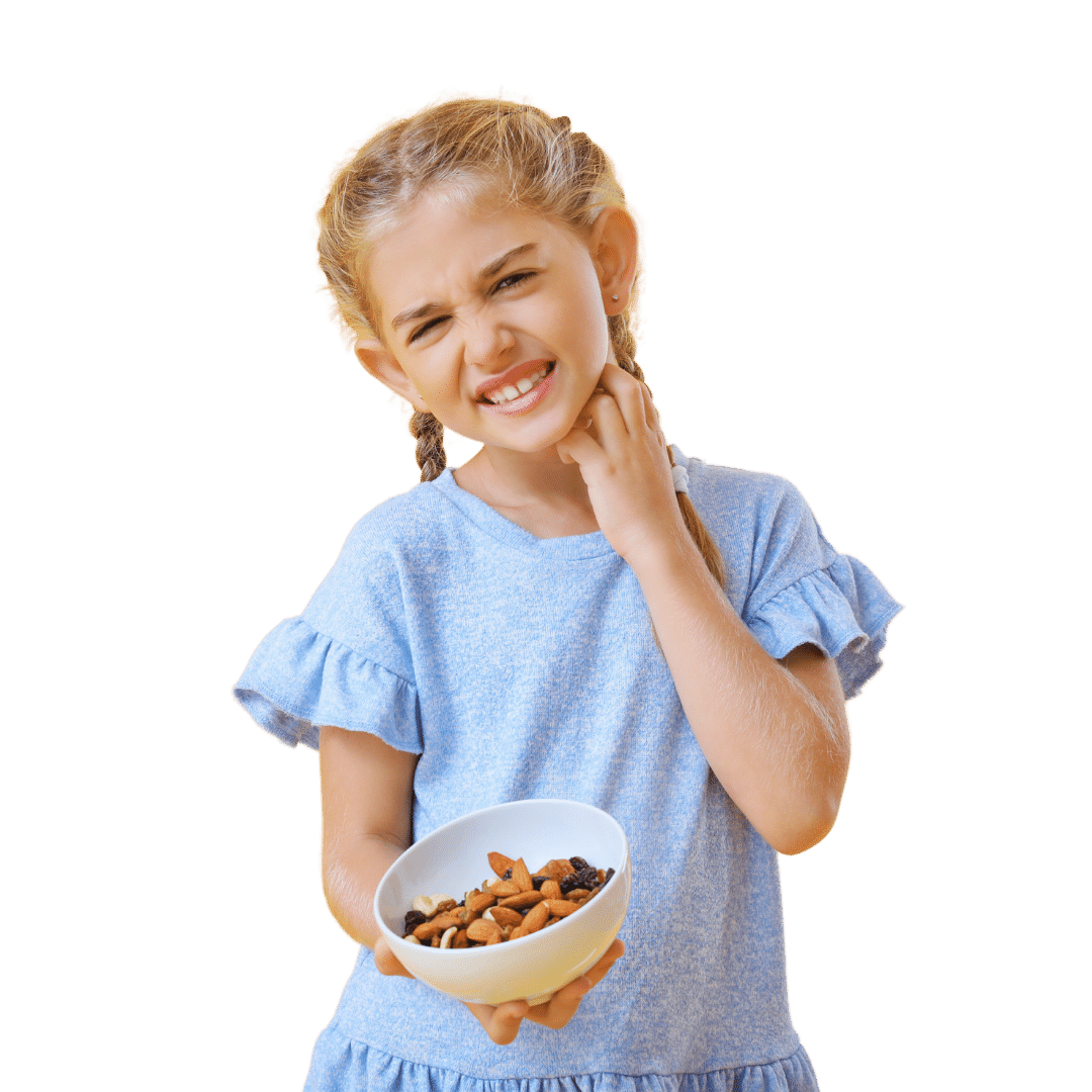 a young girl holding a bowl of nuts